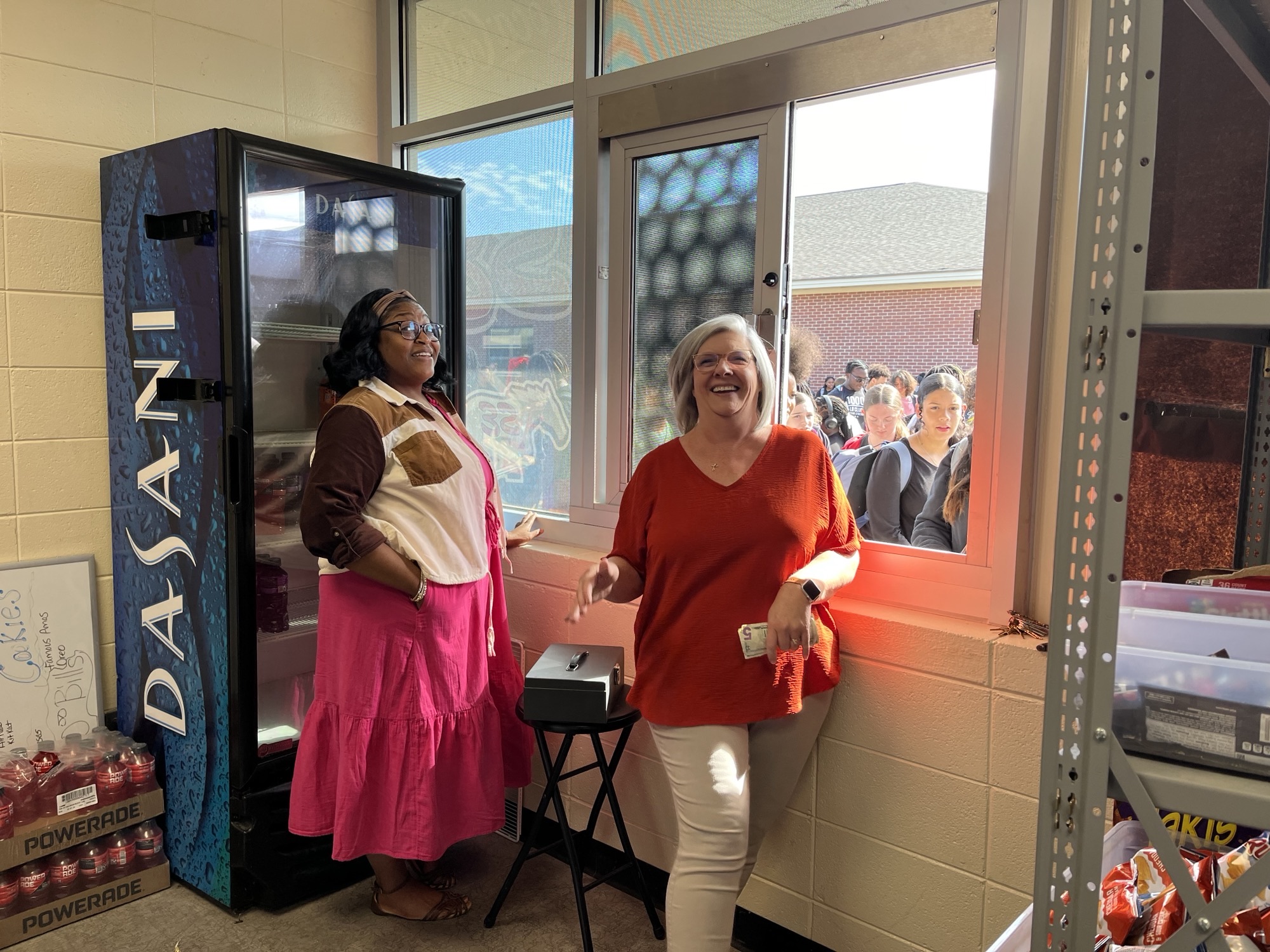 Mrs. Frieda and Ms. Tracey selling snacks