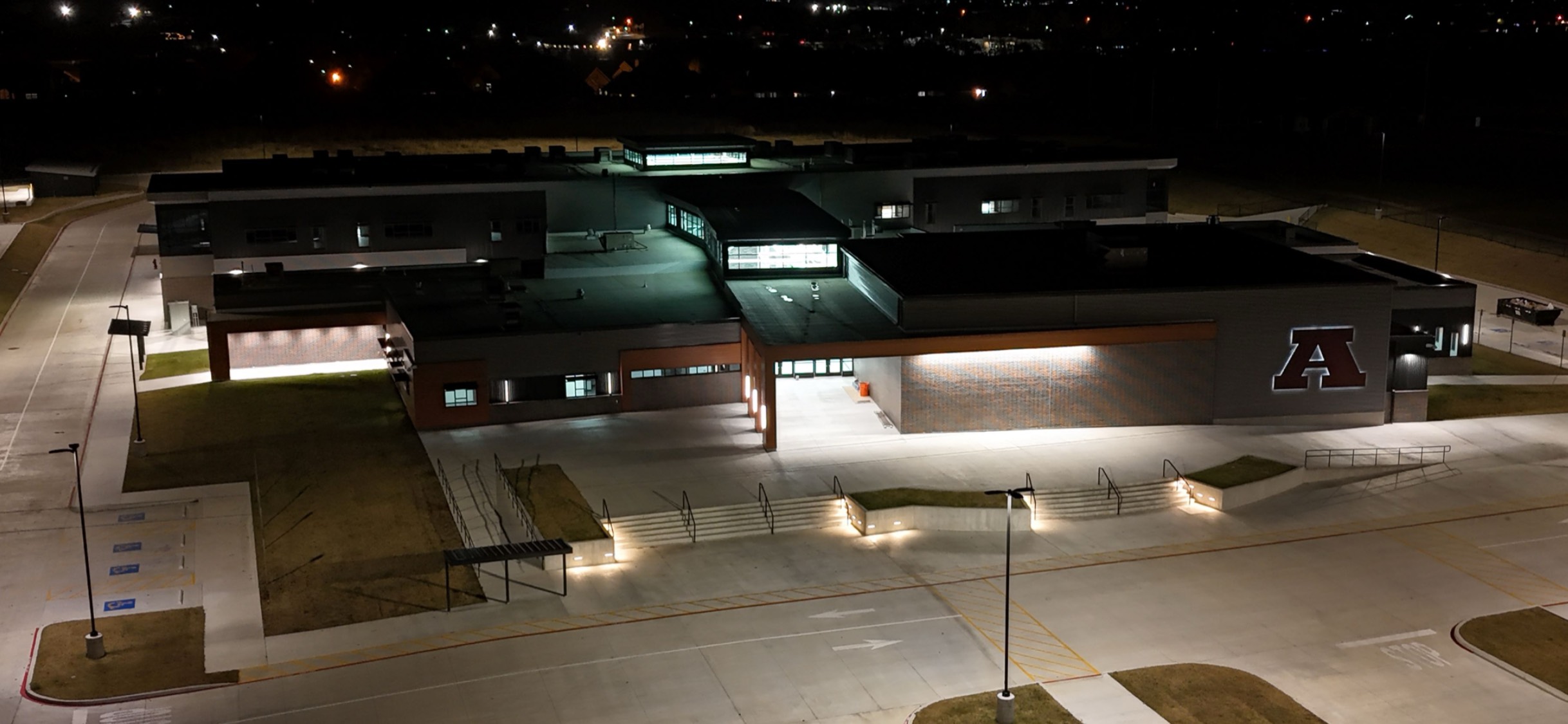 night time aerial photo of a lit up Redbud Elementary