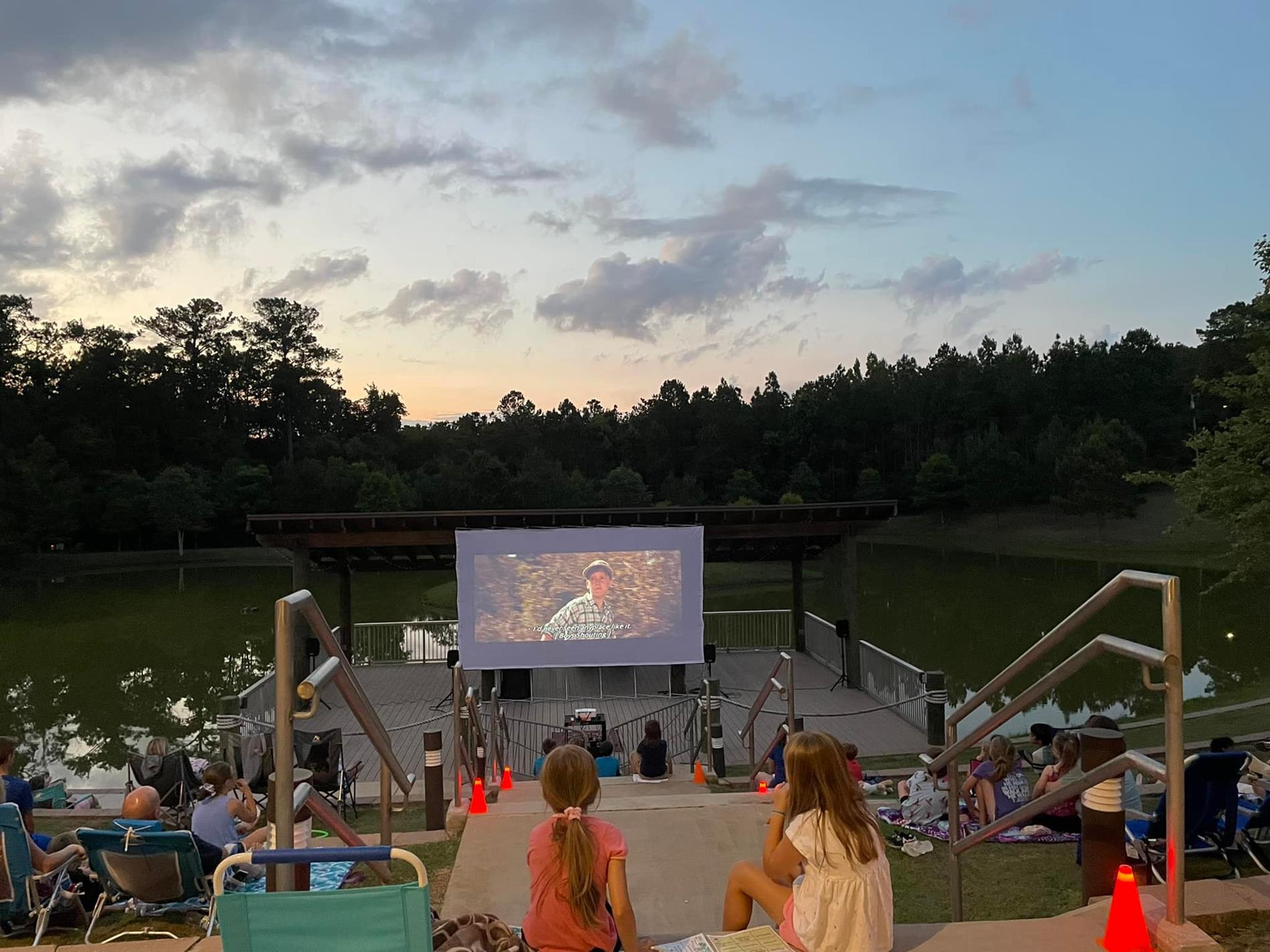 photo of people watching Sandlot on the back lawn on Spanish Fort Community Center in June 2022
