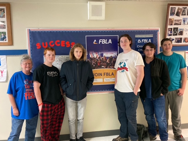 Ms. Schimmy, Coleson Myhre, Dylan Brown, Kian Eddy, Michael Bontempo, and Odin Hasby celebrate FBLA Spirit Day.  Not able to be here were Wyatt Kissner and Navarra Chappell.