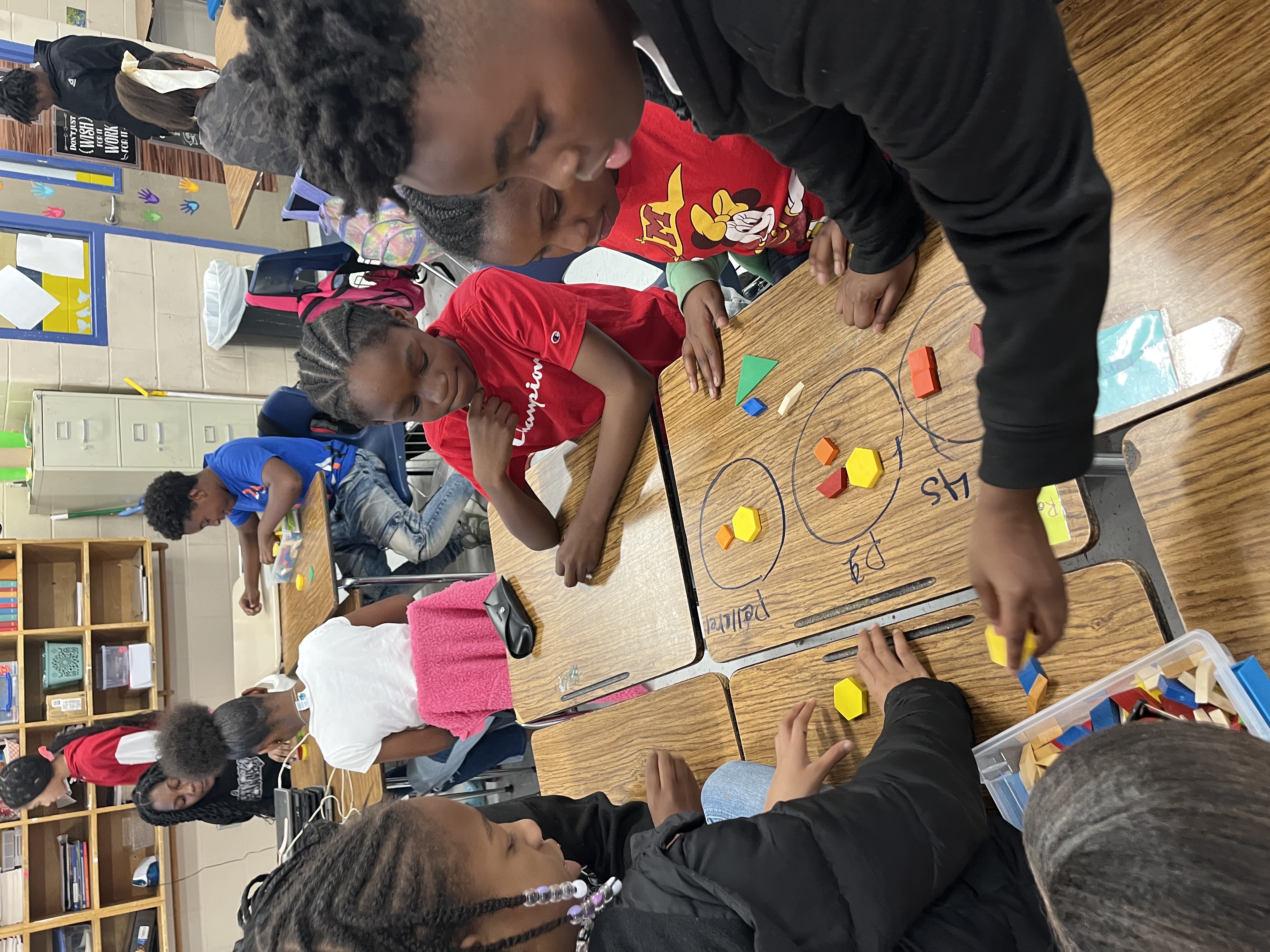 students classifying geometric shapes