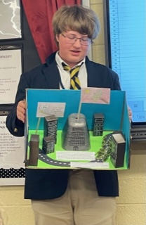 After studying the characteristics of a dystopian society in The Giver, The Hunger Games, and Anthem, the students researched, created, and presentedtheir version of a utopian society.