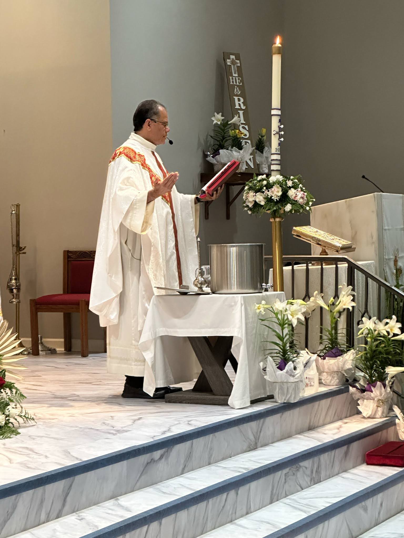 Father blesses the Holy Water