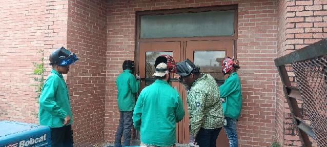 Welding Level 2 Students on Field Experience at Solomon Middle School Building 