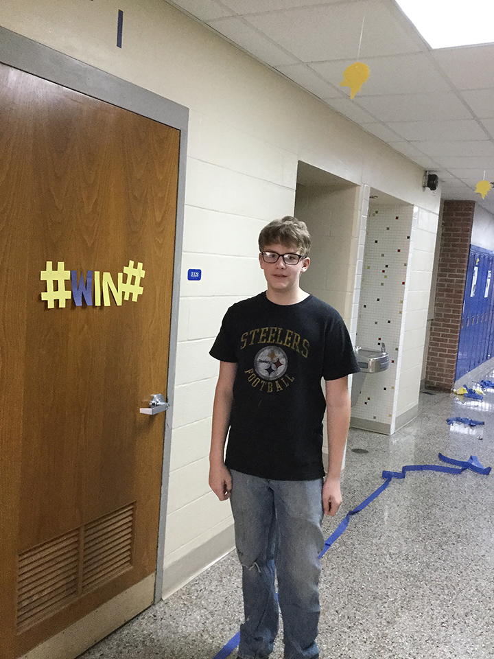 Students volunteering to help paint