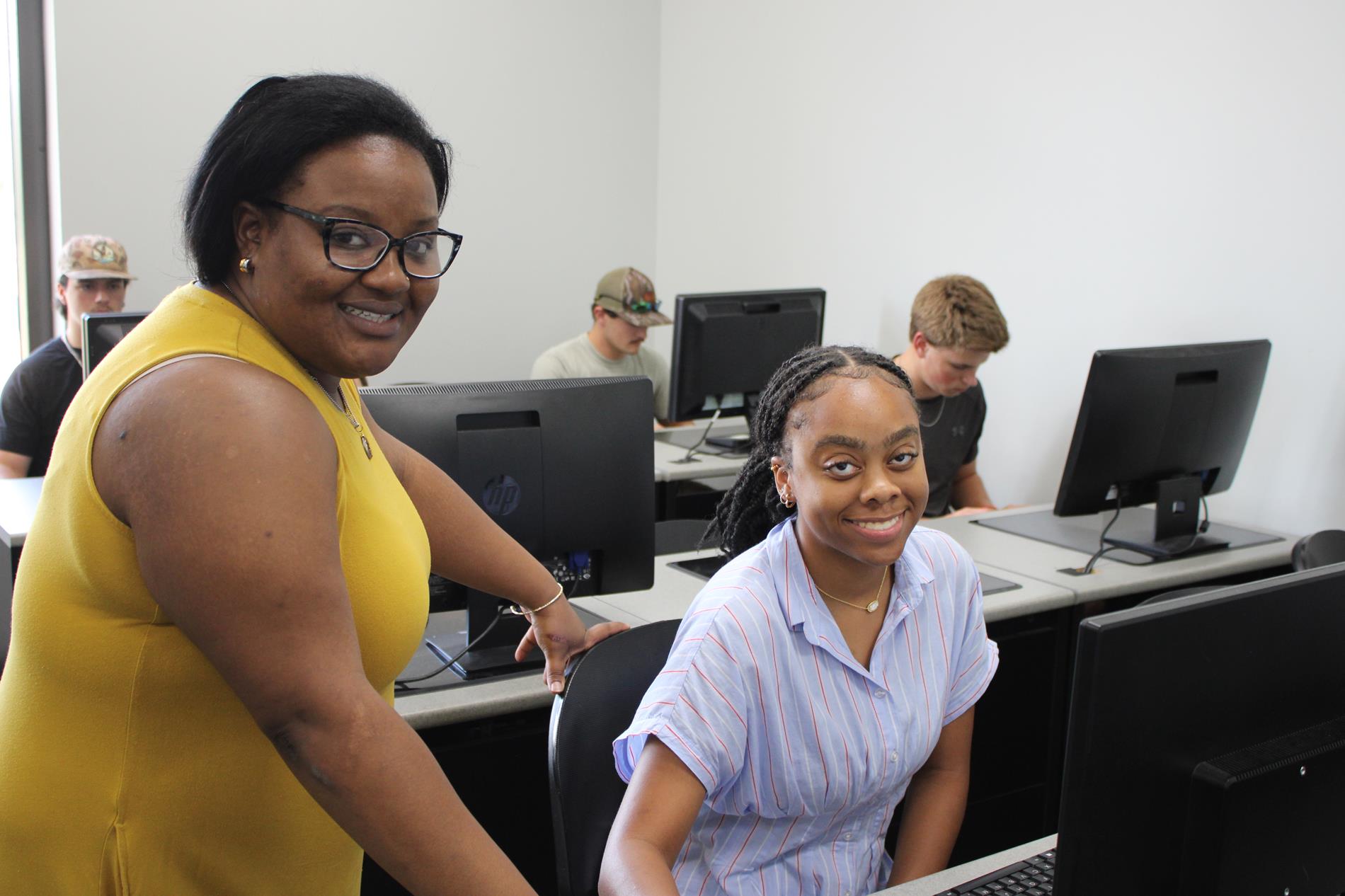 Testing Coordinator Paige Campbell helps local student with ACT Testing