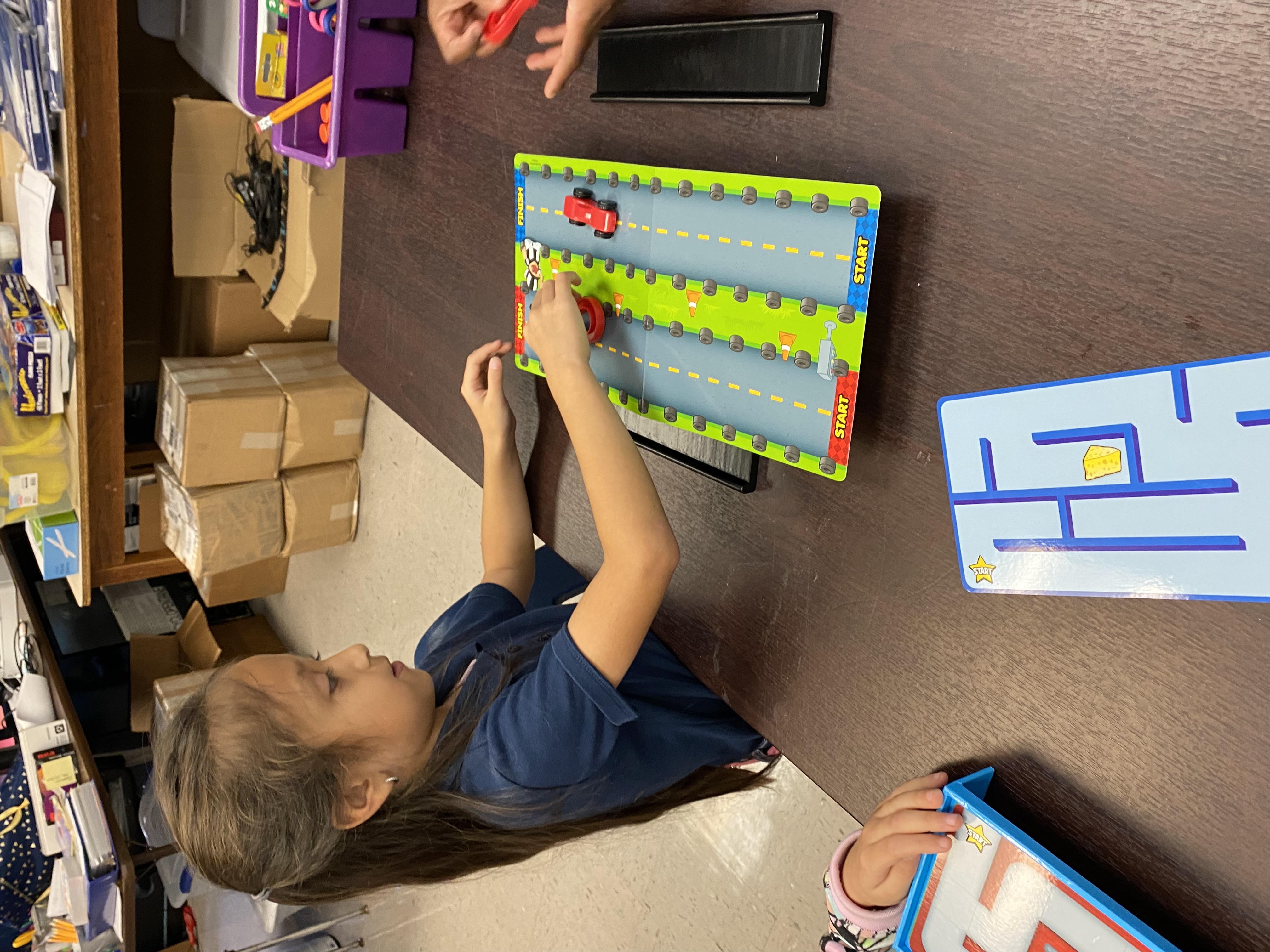 1st Grade students exploring magnets.