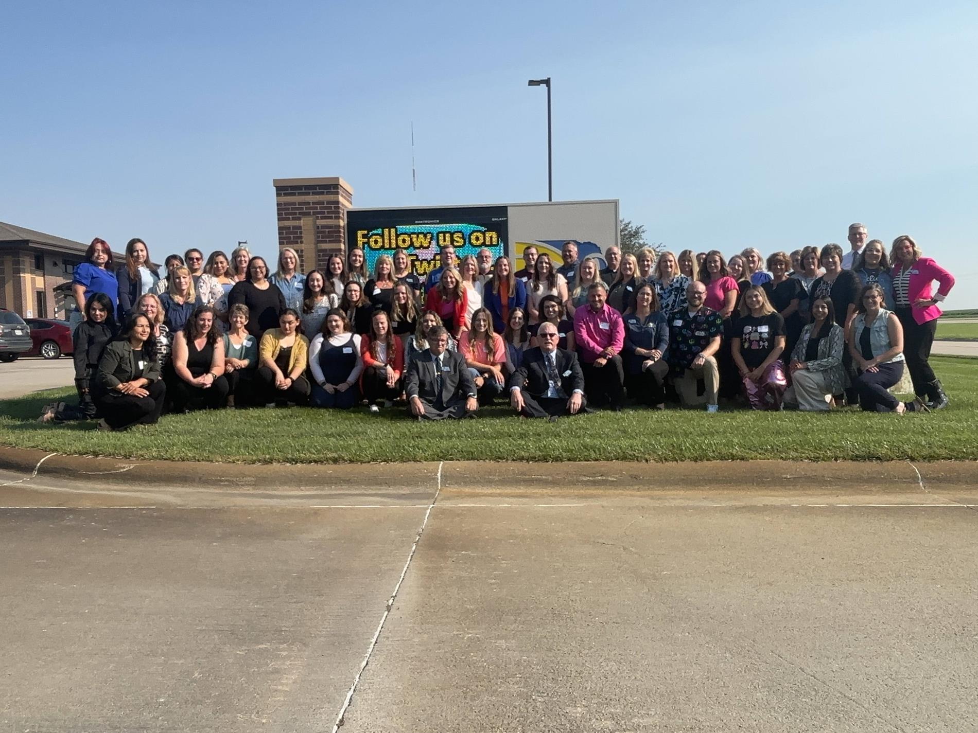 All ESU 9 Staff in front of ESU 9 Sign