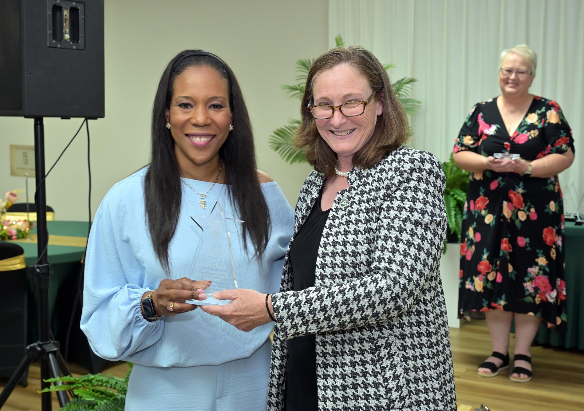 Dr. Coretta Boykin being presented Evergreen Citizen of the Year by Connie Baggett, Municipal Director of Program Management for the City of Evergreen.