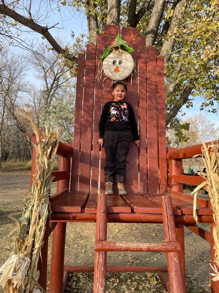 Student on the giant chair