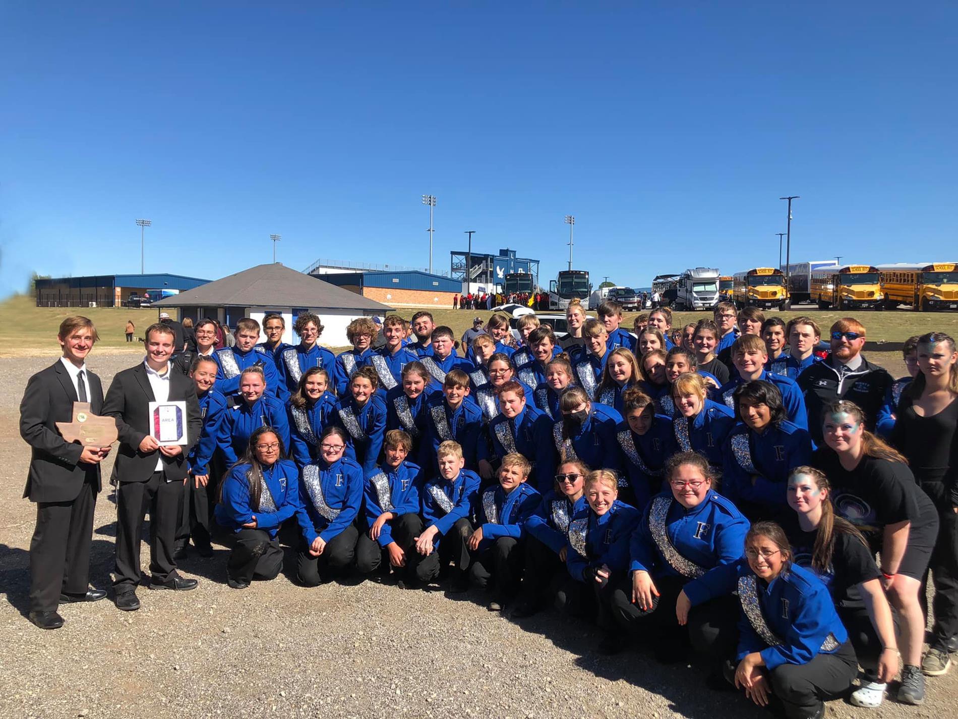 band posing with awards