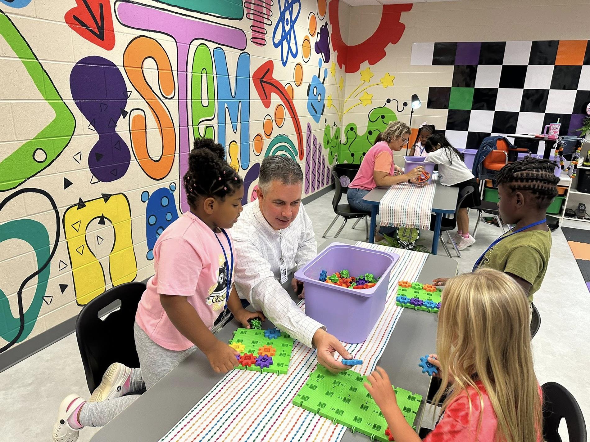 Dr. Rogers with students in the STEM lab