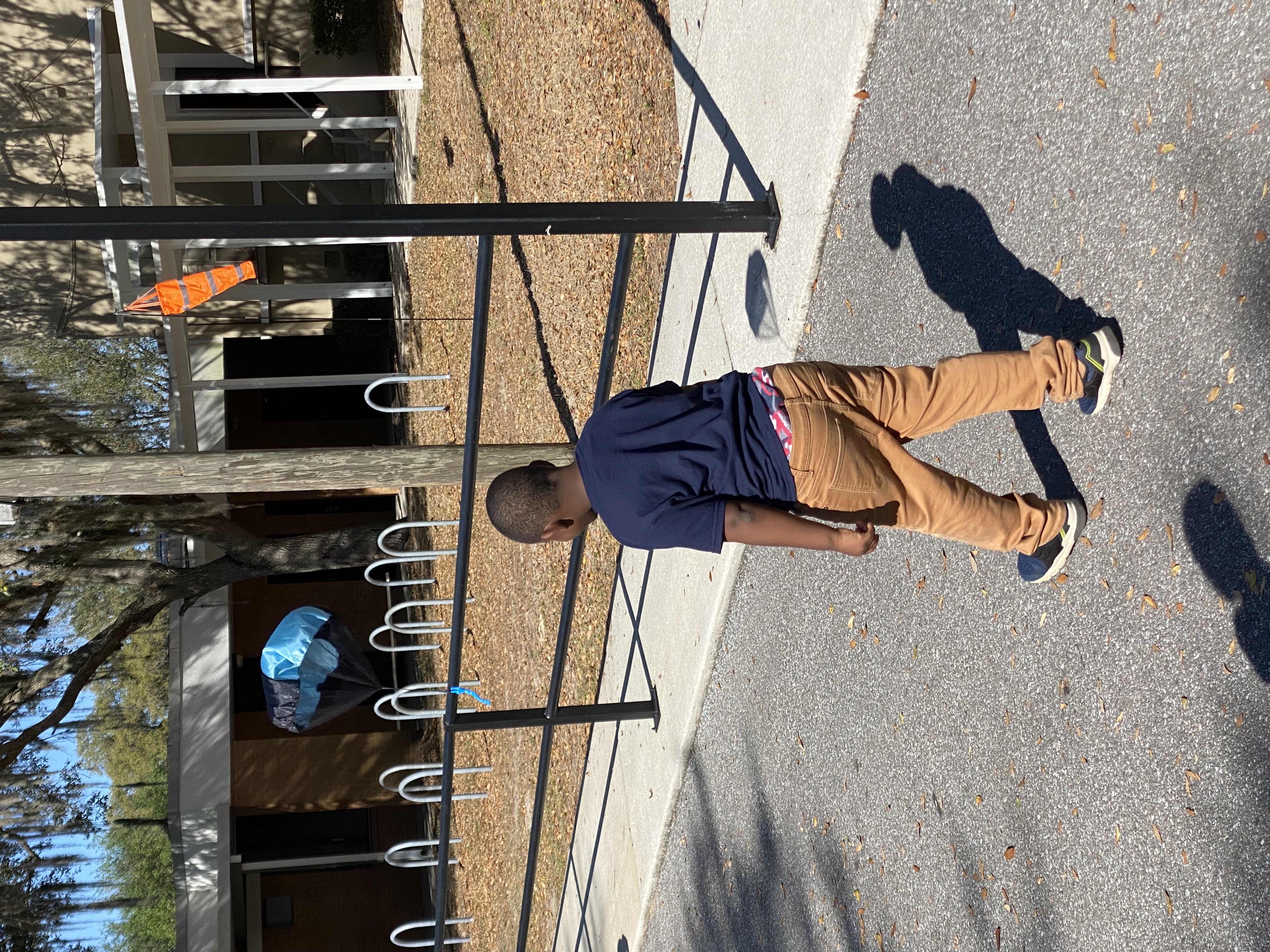 Kindergarten students exploring gravity with the parachute toys.