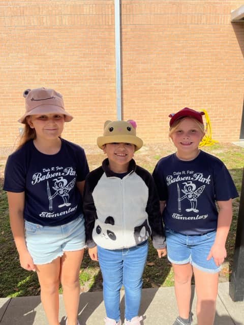 Gnats wearing hats to celebrate Hats Off To Reading on our first day of Literacy Week.