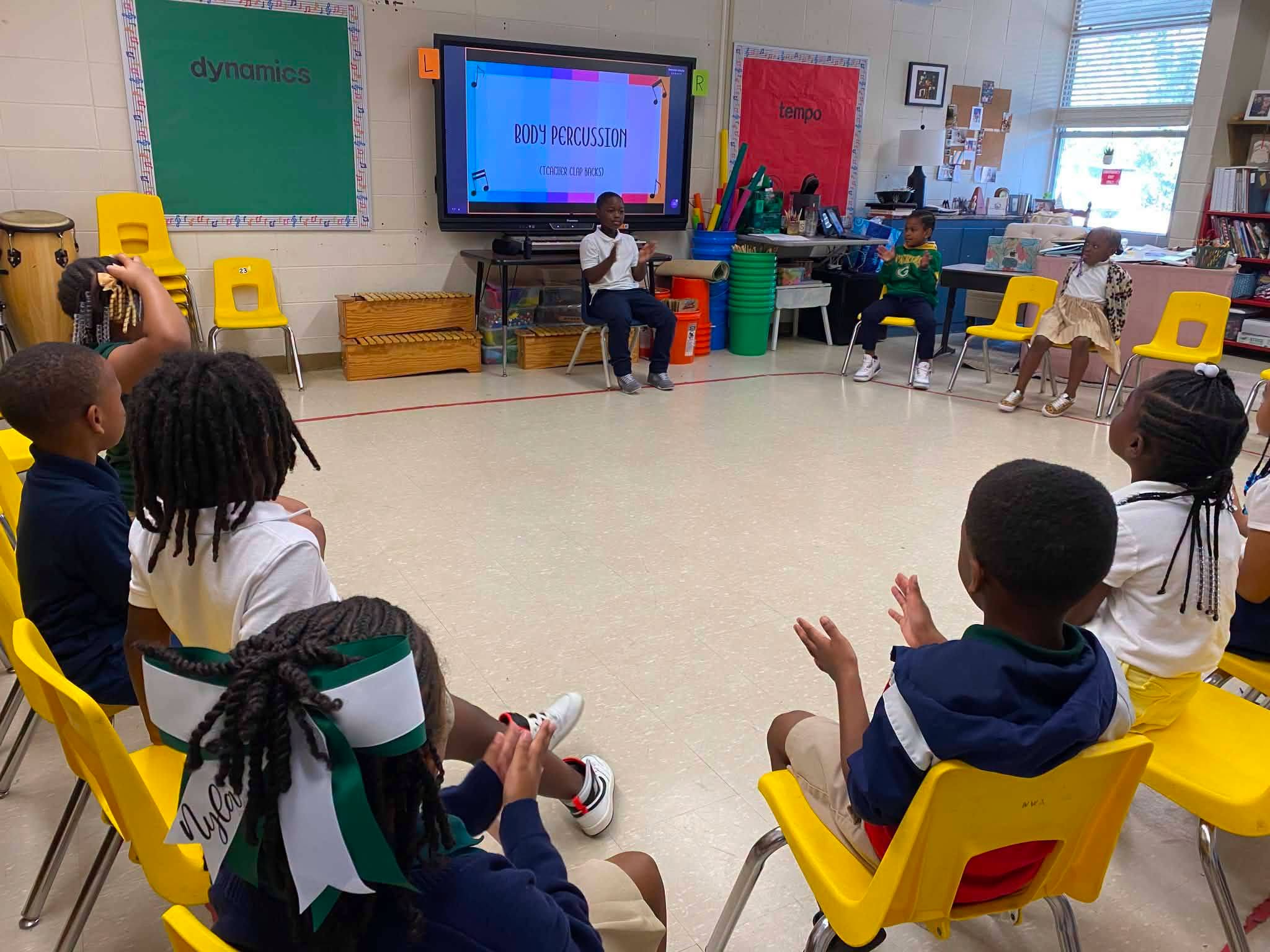Church Hill Elementary first-grade students participate in a body percussion activity during music class with Dr. Schultz.
