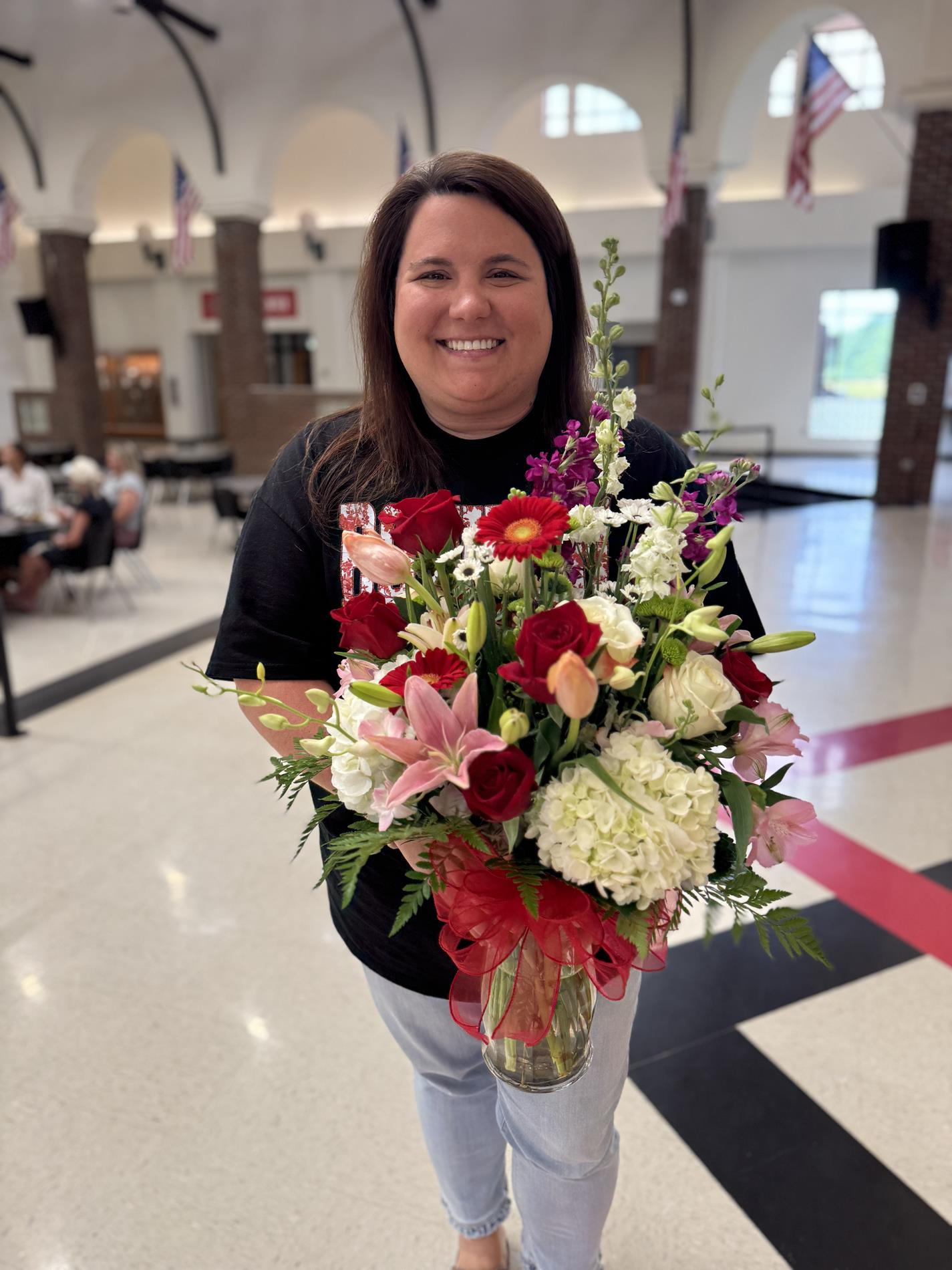 Hailey Boggus - Teacher of the Year holding flowers