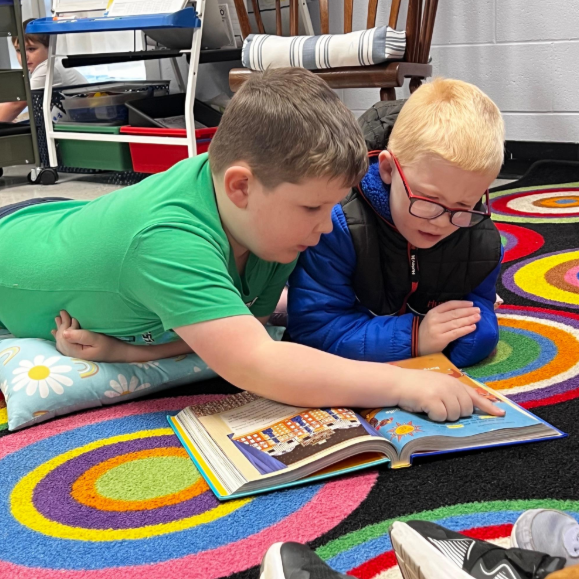 Students reading together in library