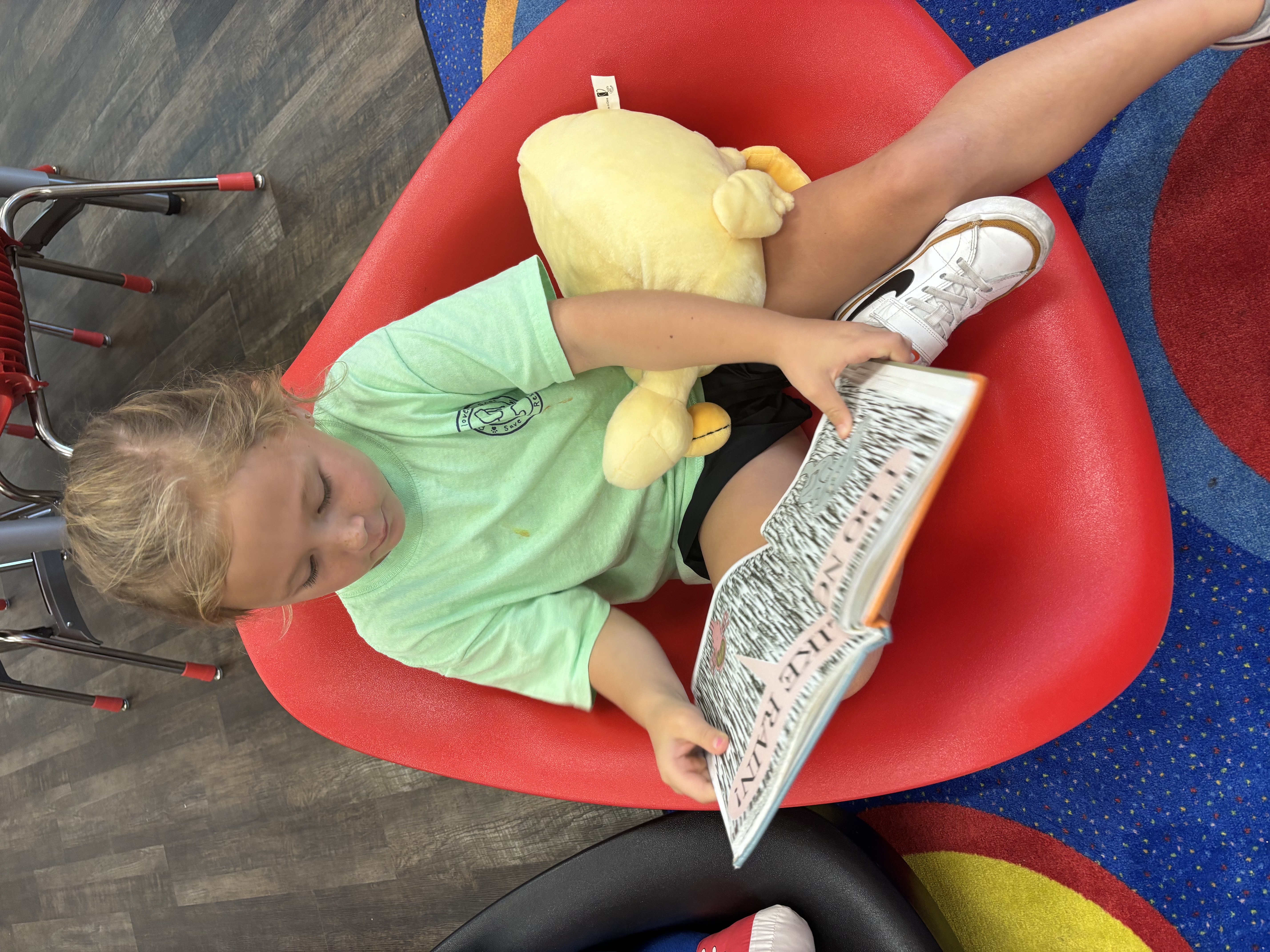 Student reading to book buddy