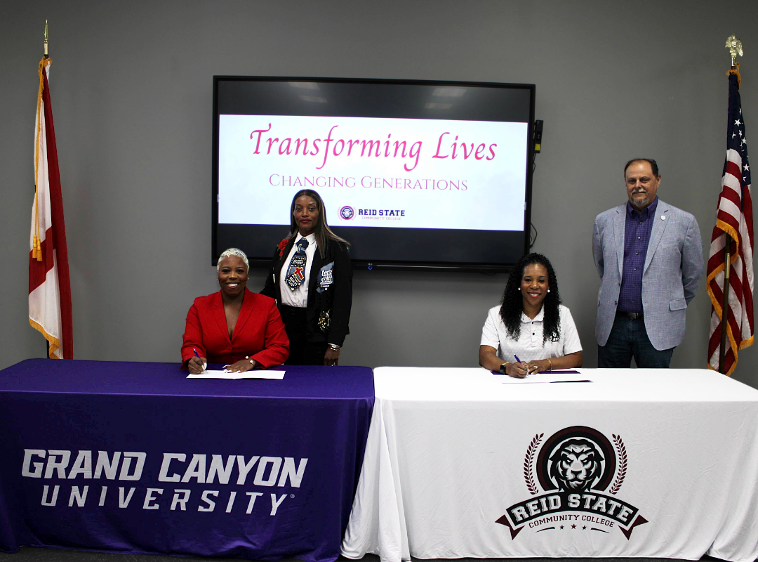 Diva Hall with Grand Canyon University and Dr. Coretta Boykin with Reid State sign collaborative agreement