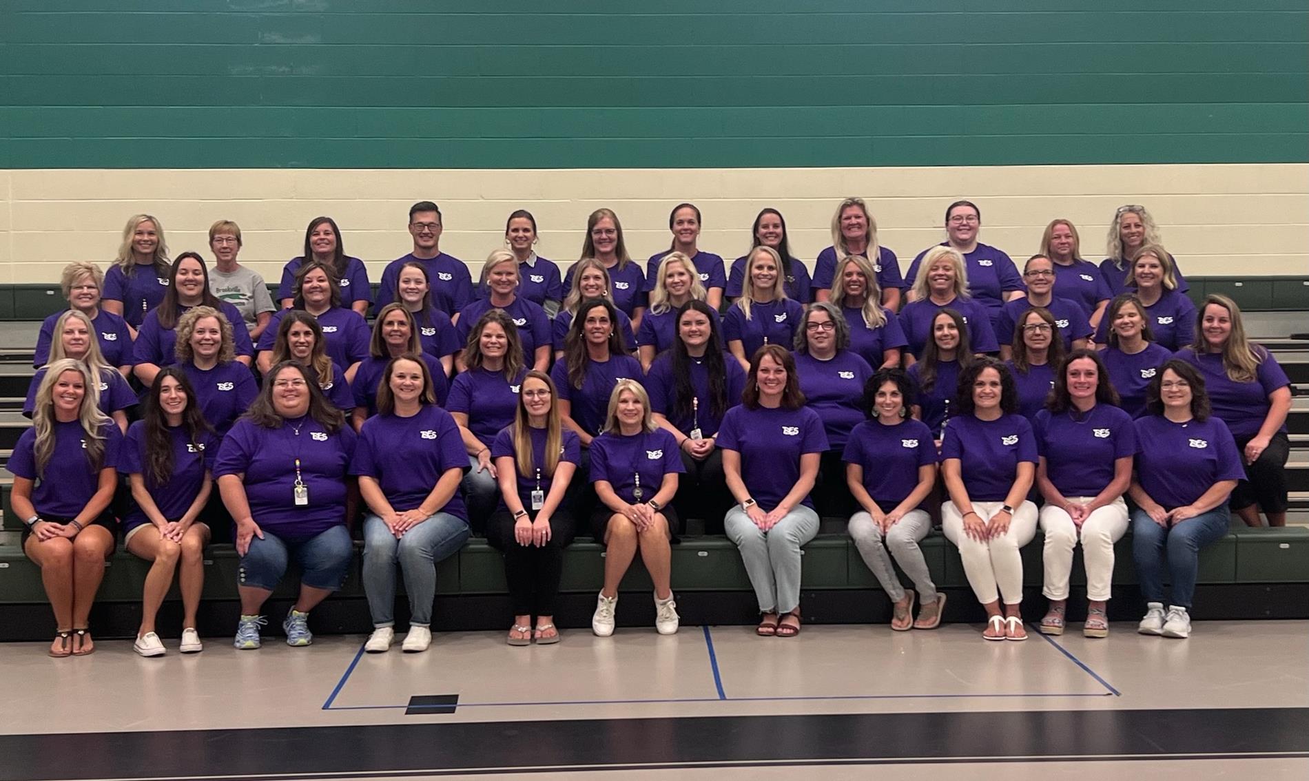 staff picture wearing matching bes wear