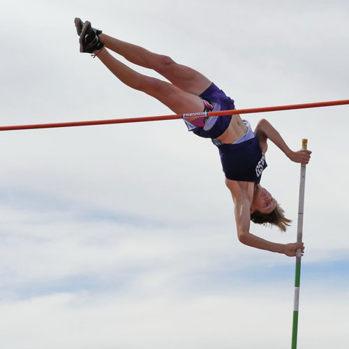 Boy clears height during his pole vault
