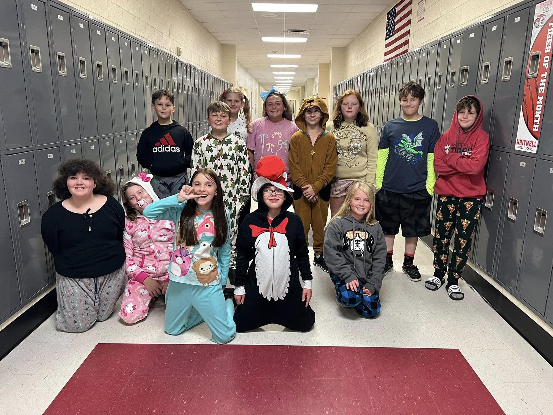 Group of students dressed in different pajamas being their "younger self" for homecoming.