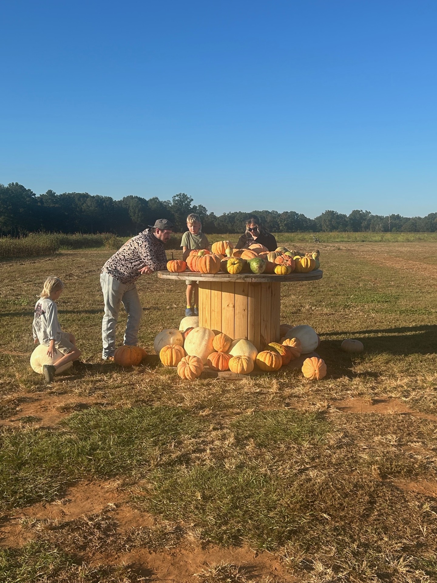 Family at the Pumpkin Patch at Arena Acres