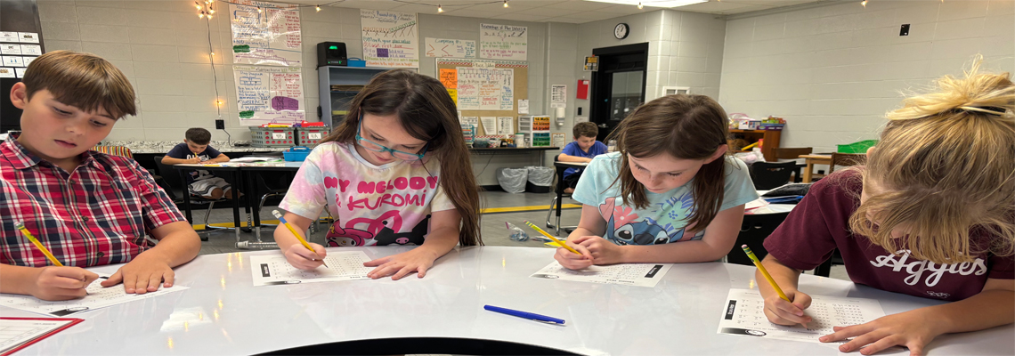 Elementary students working in class