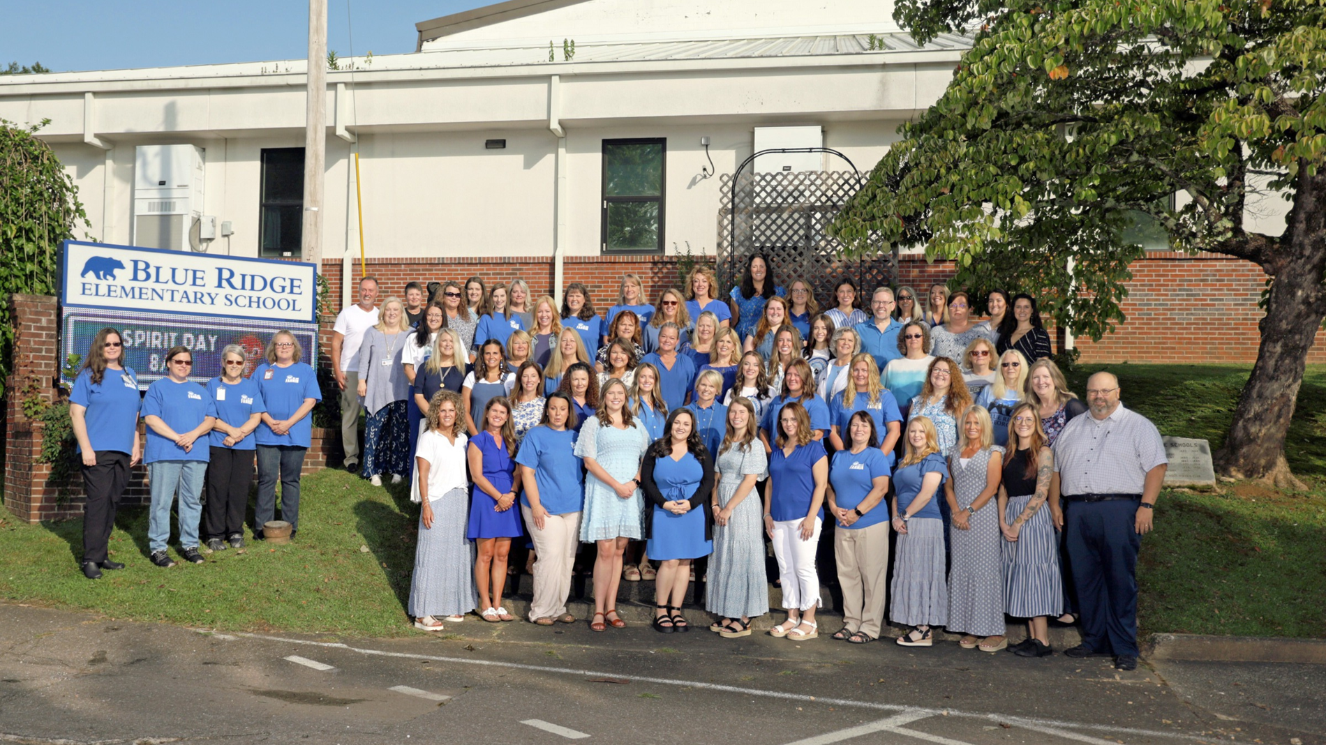 BRES Staff standing in front of the school