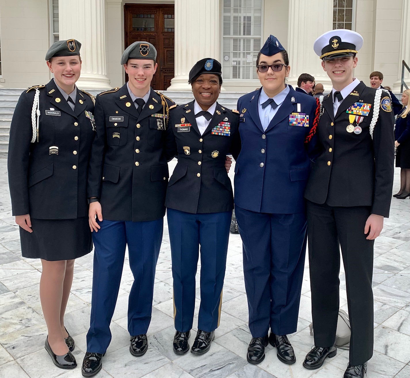 Career Technical Student Organization JROTC Officers and the AL CTE JROTC Section President pose for a group photo on the steps of Alabama State Capitol for CTE on the Hill.