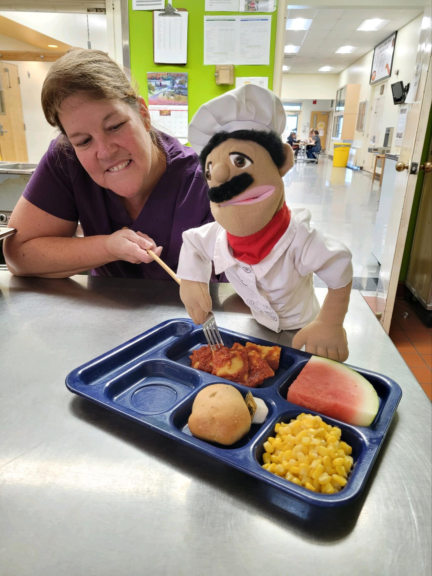 Marie and Chef Jacques (Puppet) and tray of food