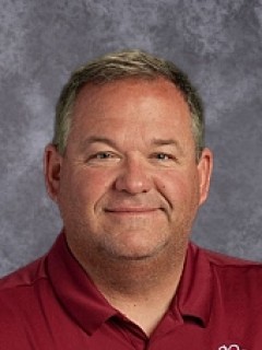 Coach Burnett on grey background