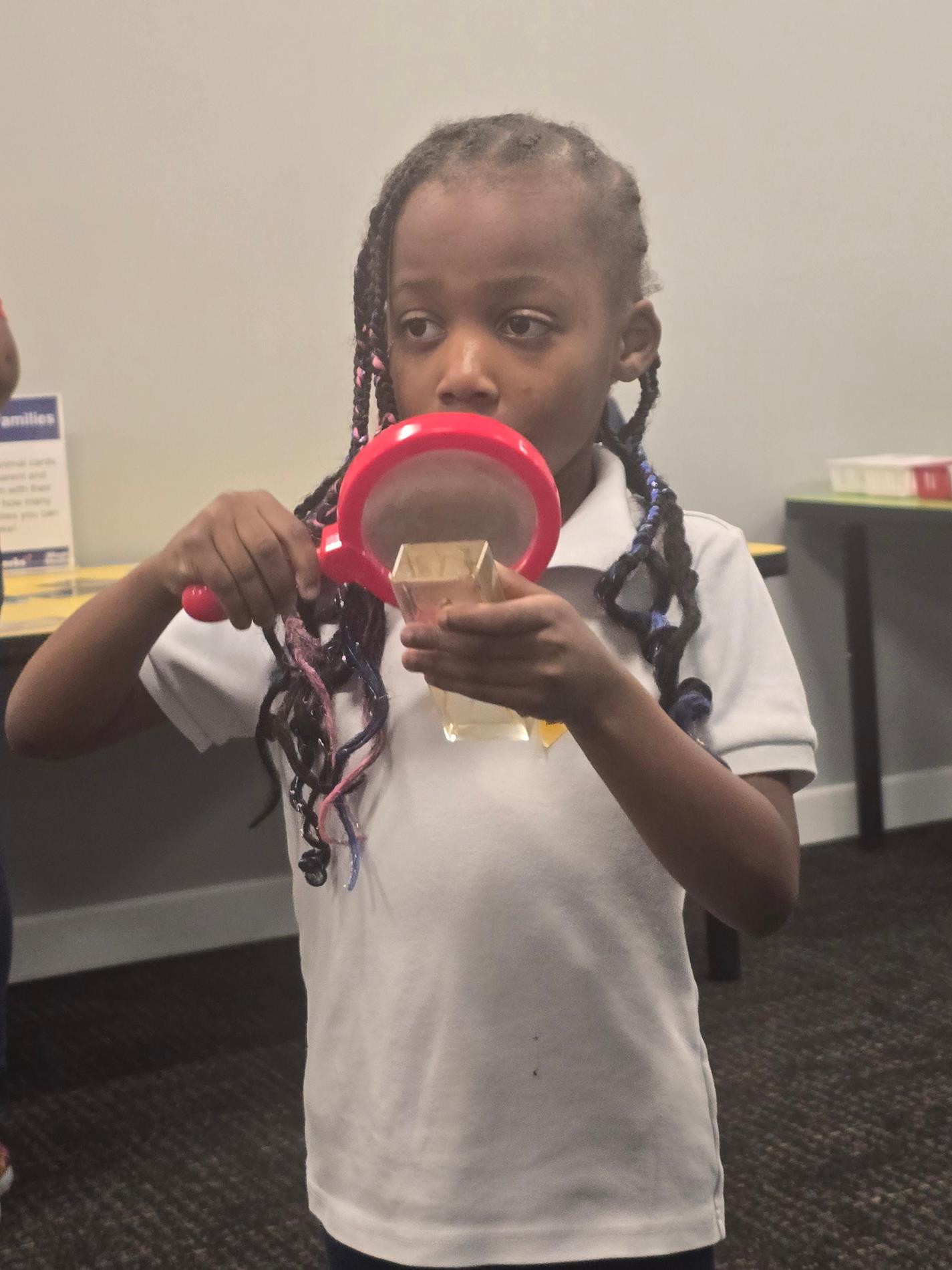 Student and Magnifying Glass