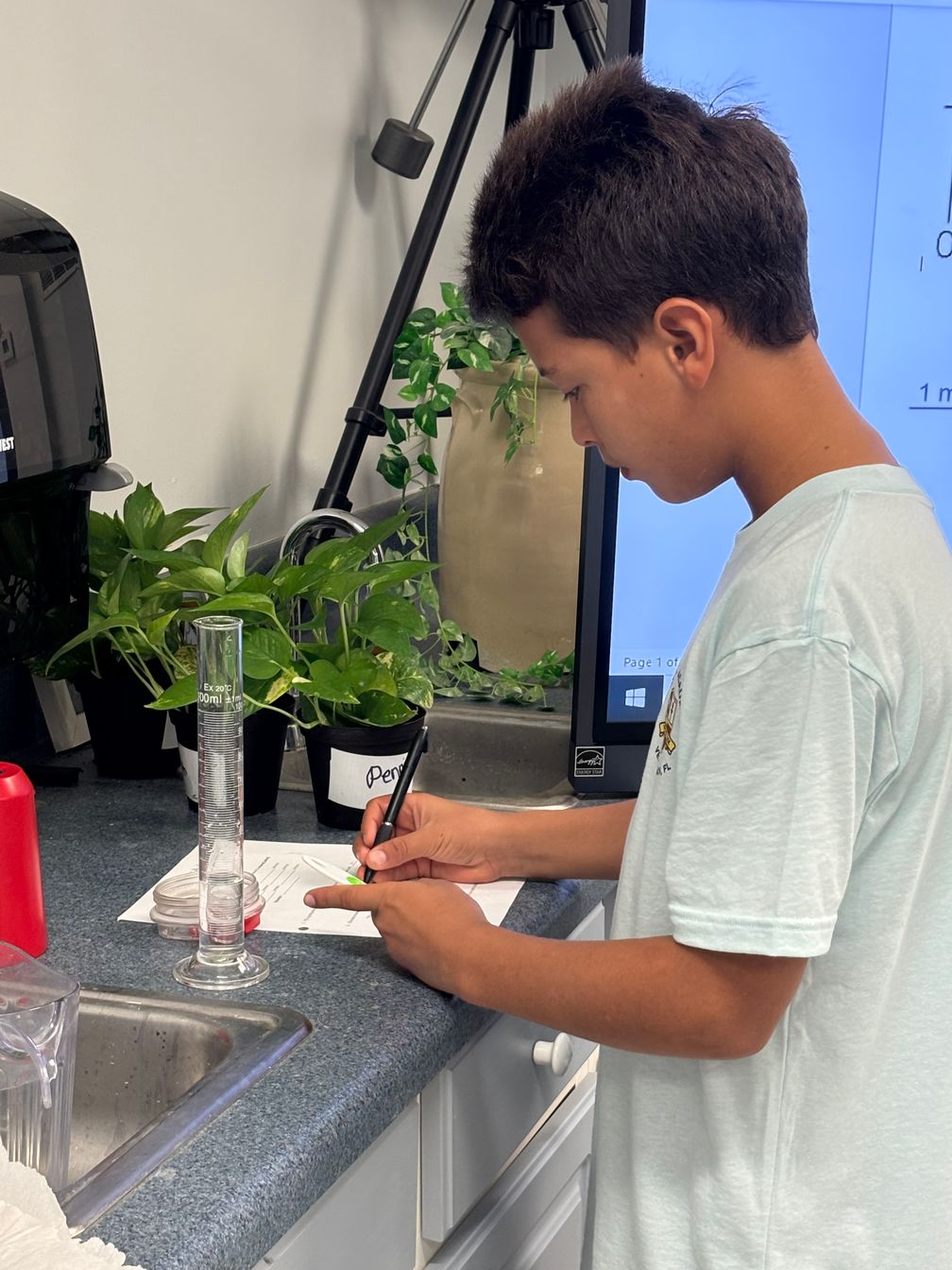 student working on science project