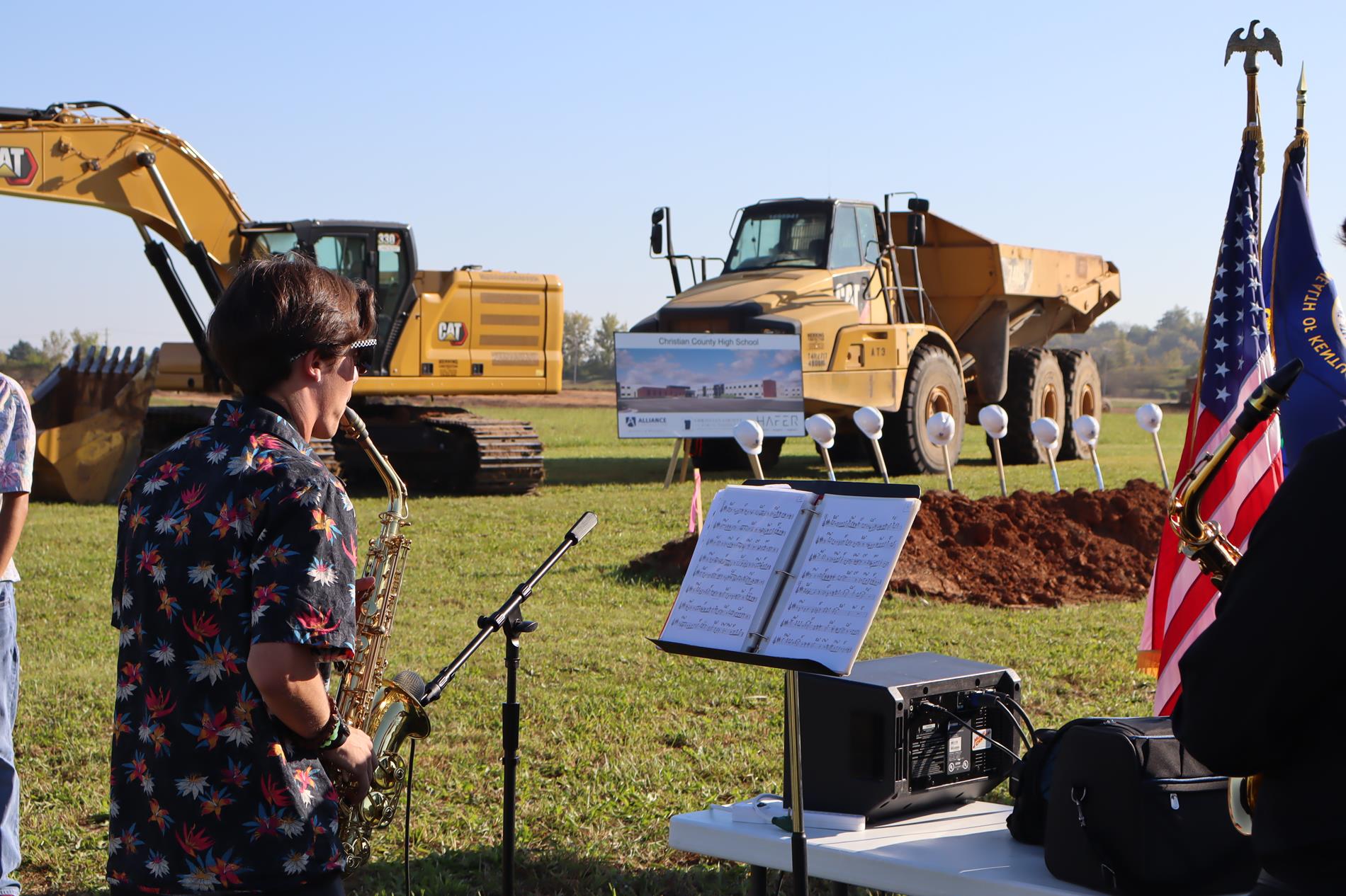 Student at Groundbreaking playing music