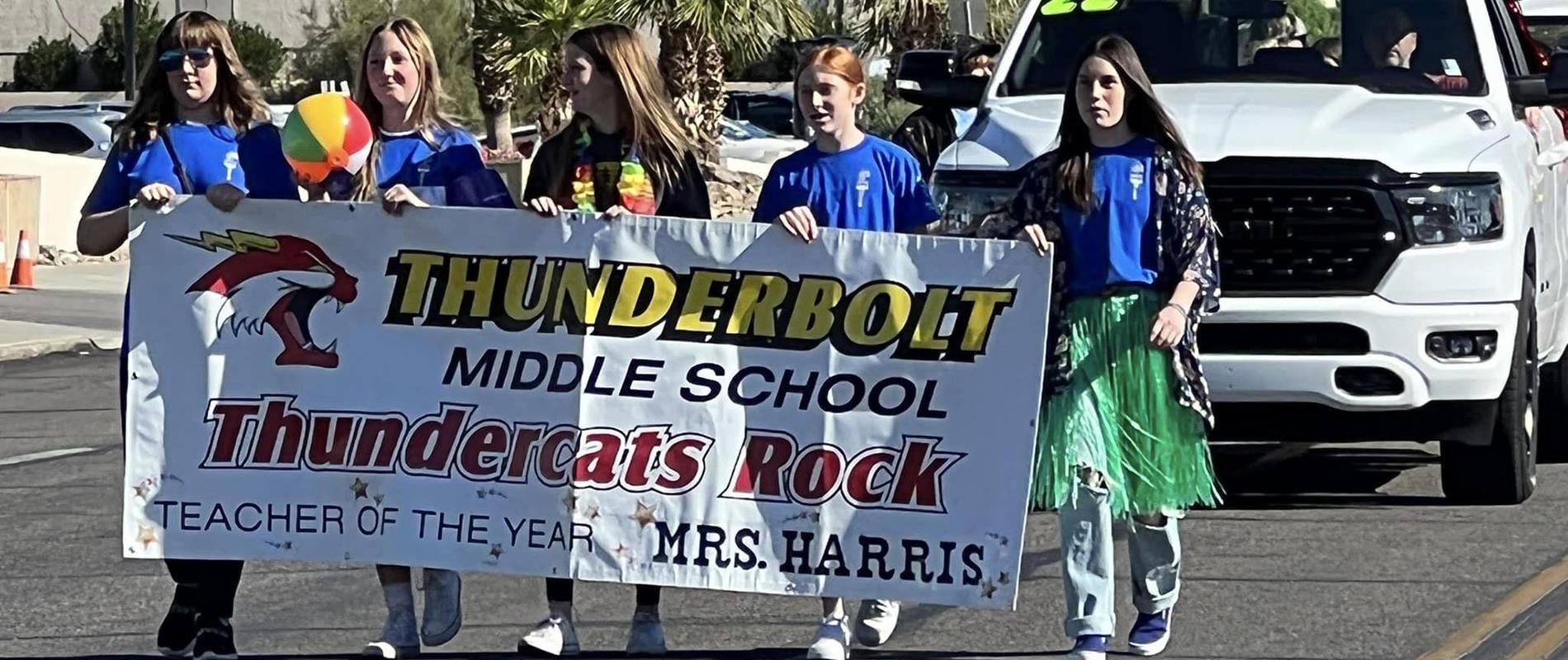 Thunderbolt students marching with school banner in the 2022 London Bridge Days Parade