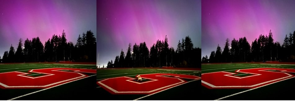 the northern lights over the turf field at Seaside schools