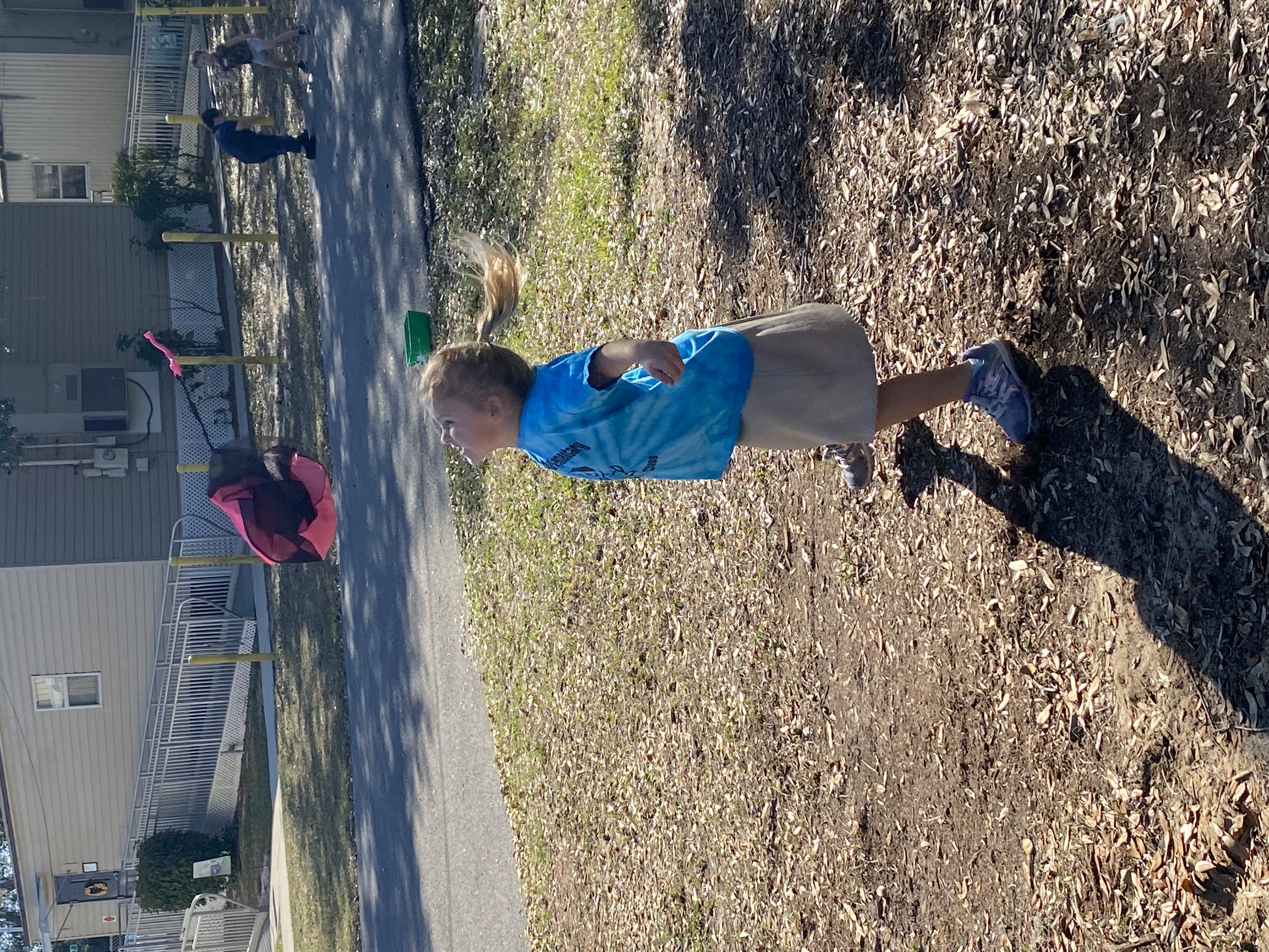 Kindergarten students exploring gravity with the parachute toys.