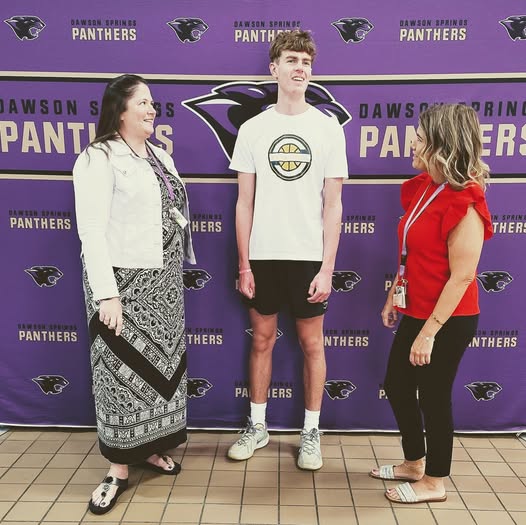 (Dawson Springs Jr./Sr. High School administrators Micki Clark and Elizabeth Robinson catch up with senior Deacon Dever on Thursday morning.)