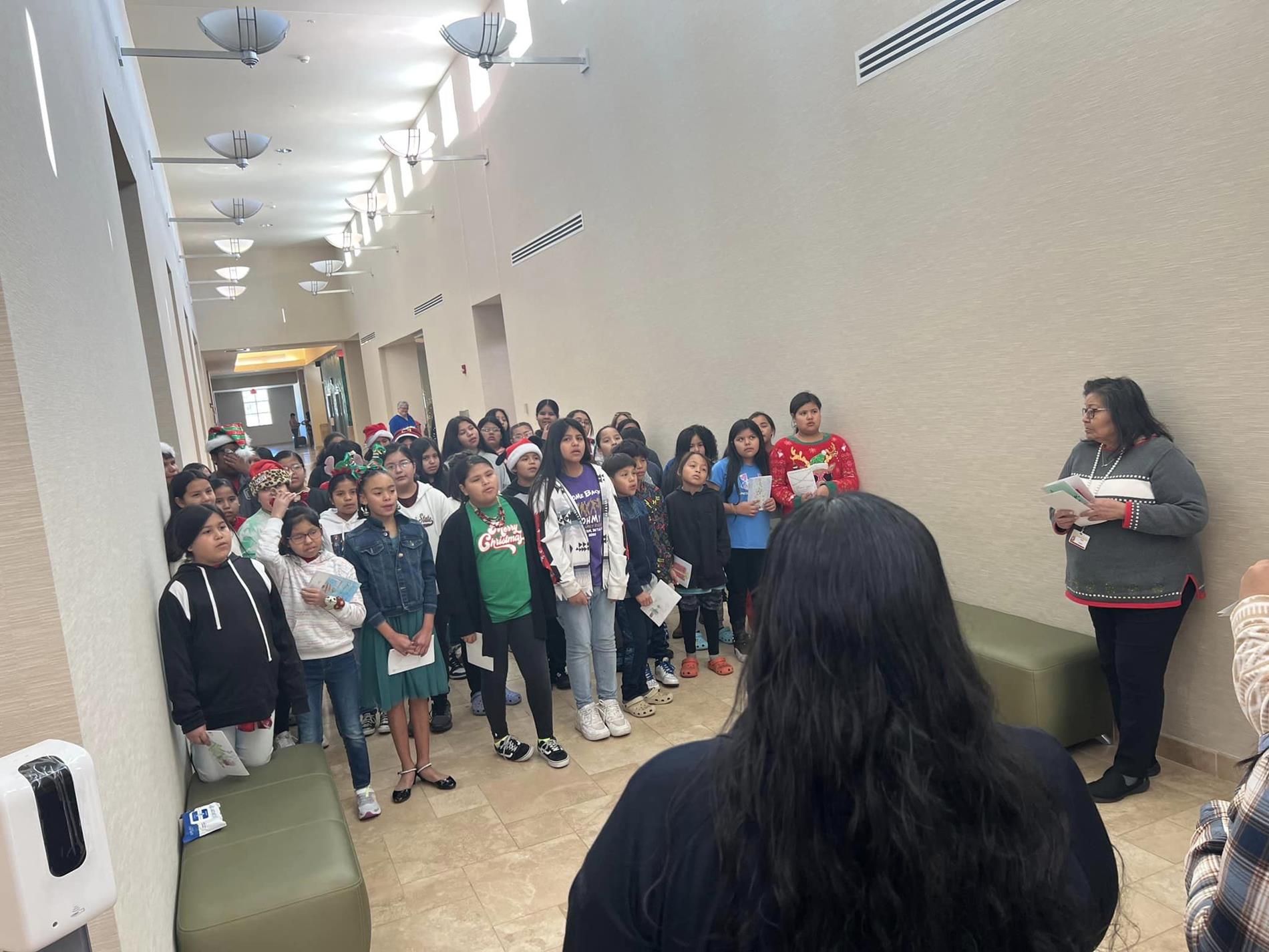 Dec 2023 Jr. Beta students caroling at the Justice Complex and the Fire Department