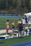 Cross Country Boys State Champs awards ceremony, runner receiving handshake