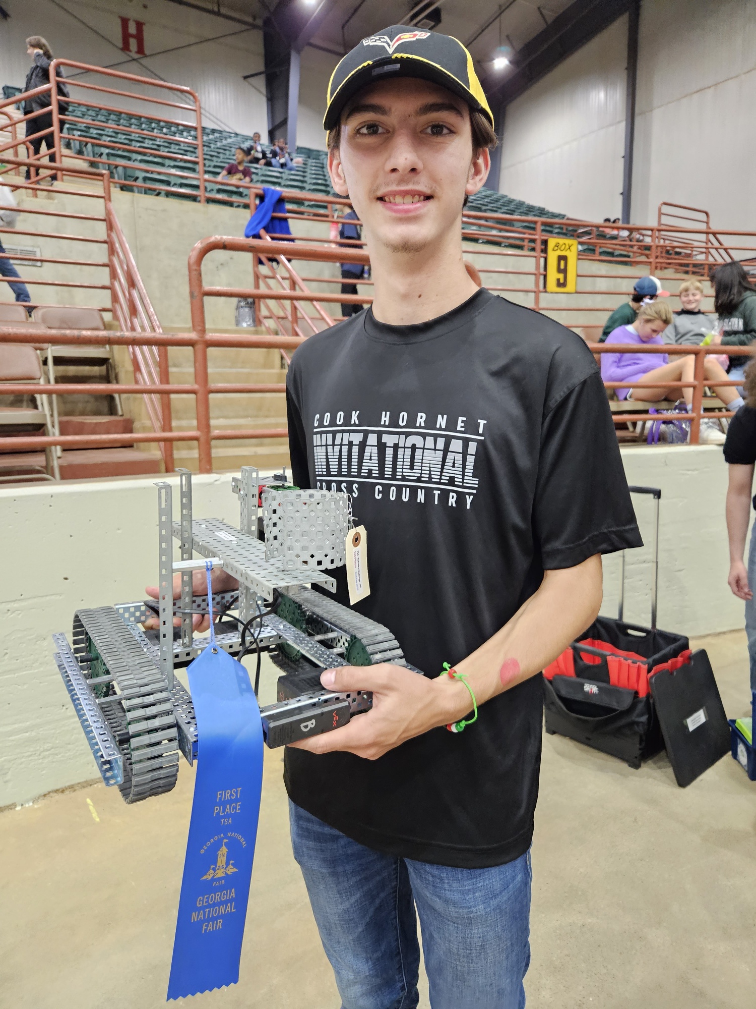 Caden showing off hardware from TSA day at the Fair. Robotics