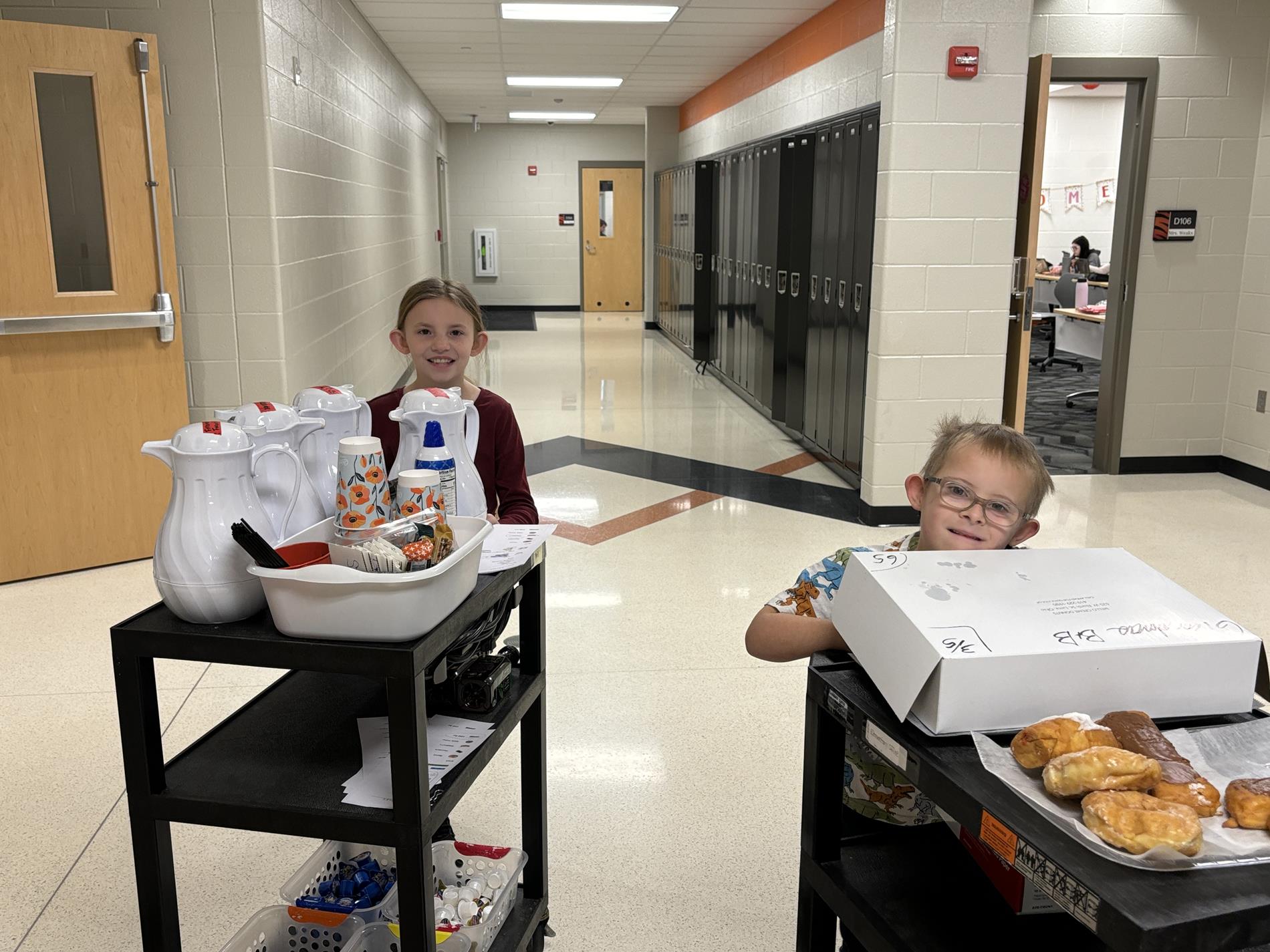 Students on Breakfast and Brew Crew delivering coffee to the staff