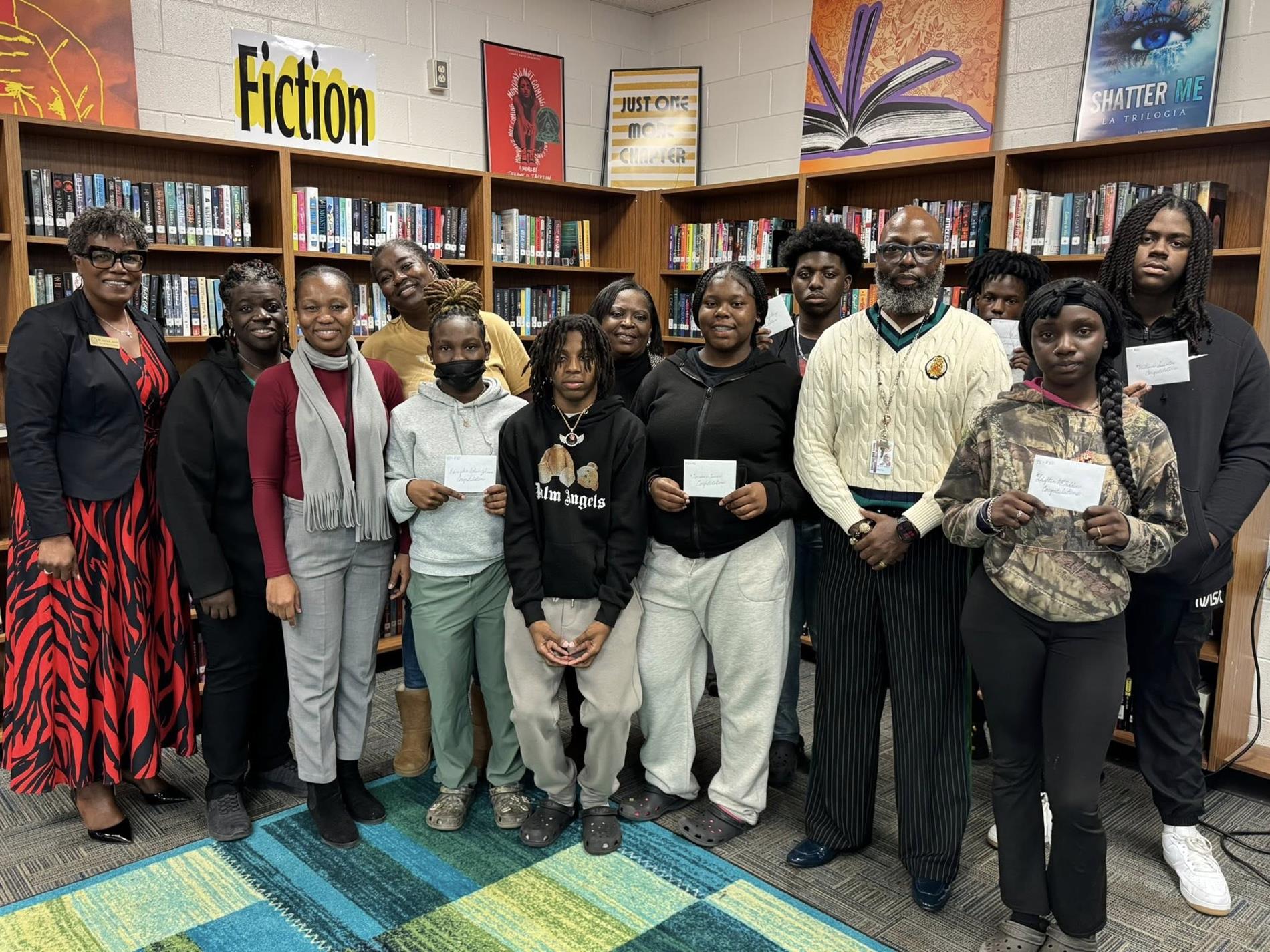people standing together in a library
