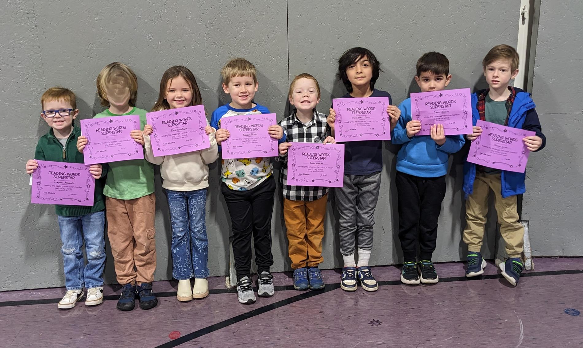 kindergarten students that were awarded for reading all tricky, color, and number words