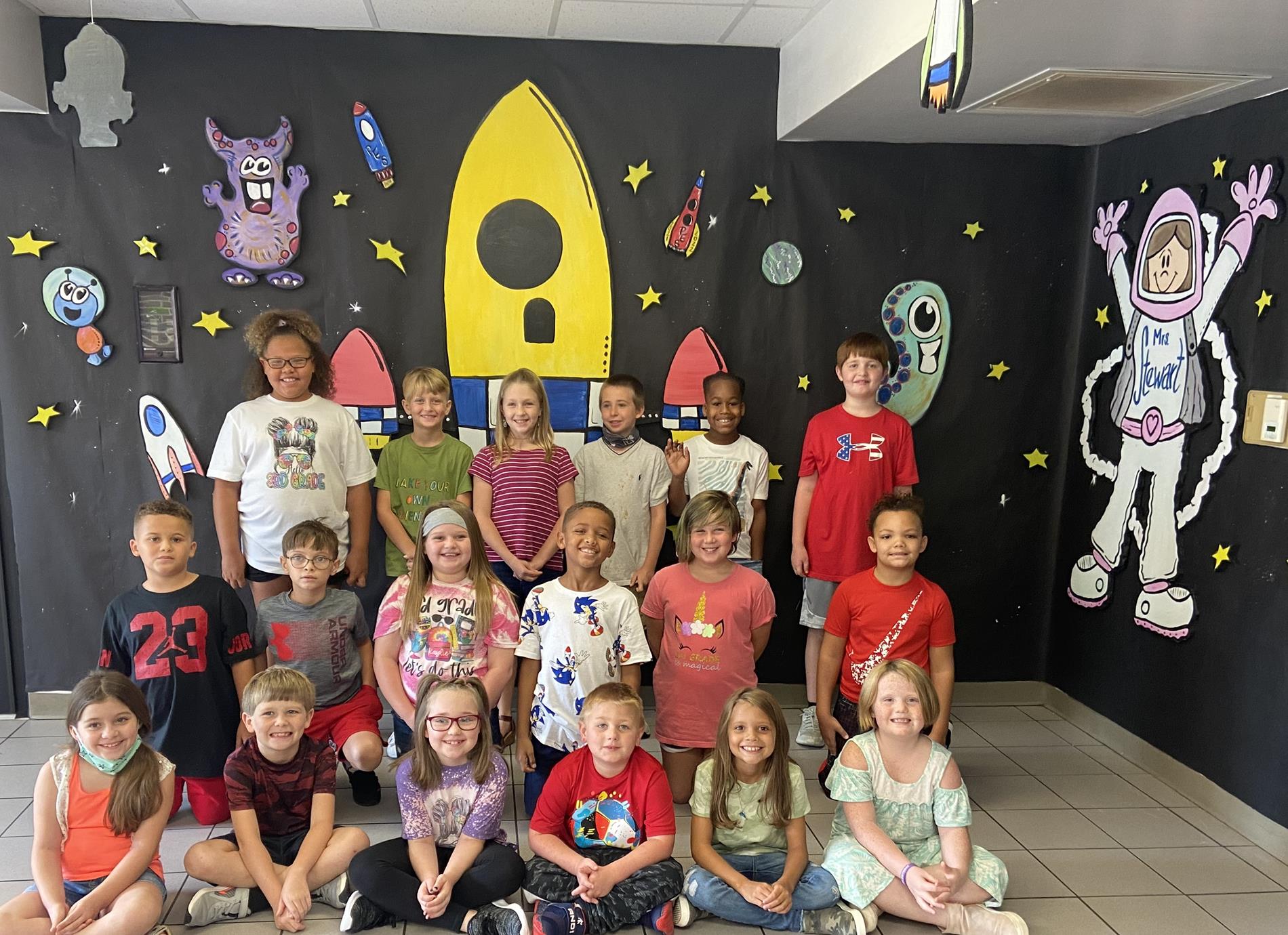 kids in front of space display