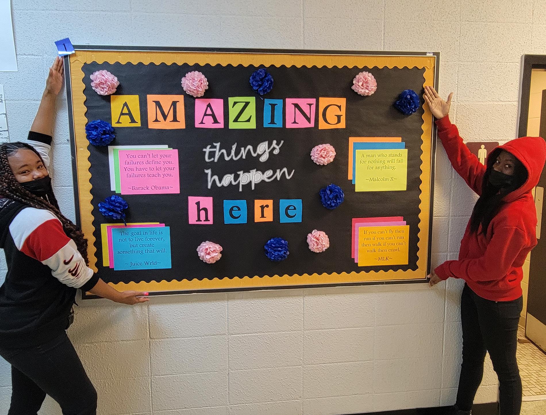 Students display amazing things happen here board
