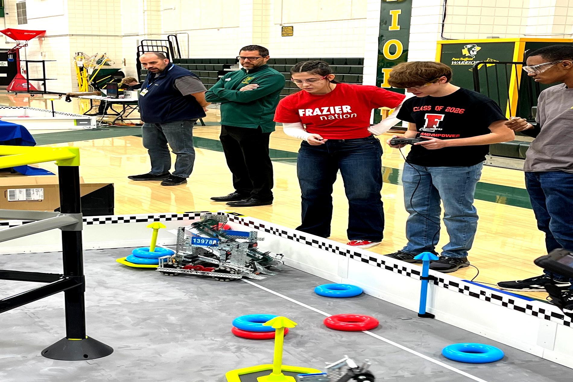 Lanie Howard and Lucas Salaway are representing Frazier Robotics Club at the Penn Trafford Vex Qualifier Match. They are driving a robot that they built and coded themselves.