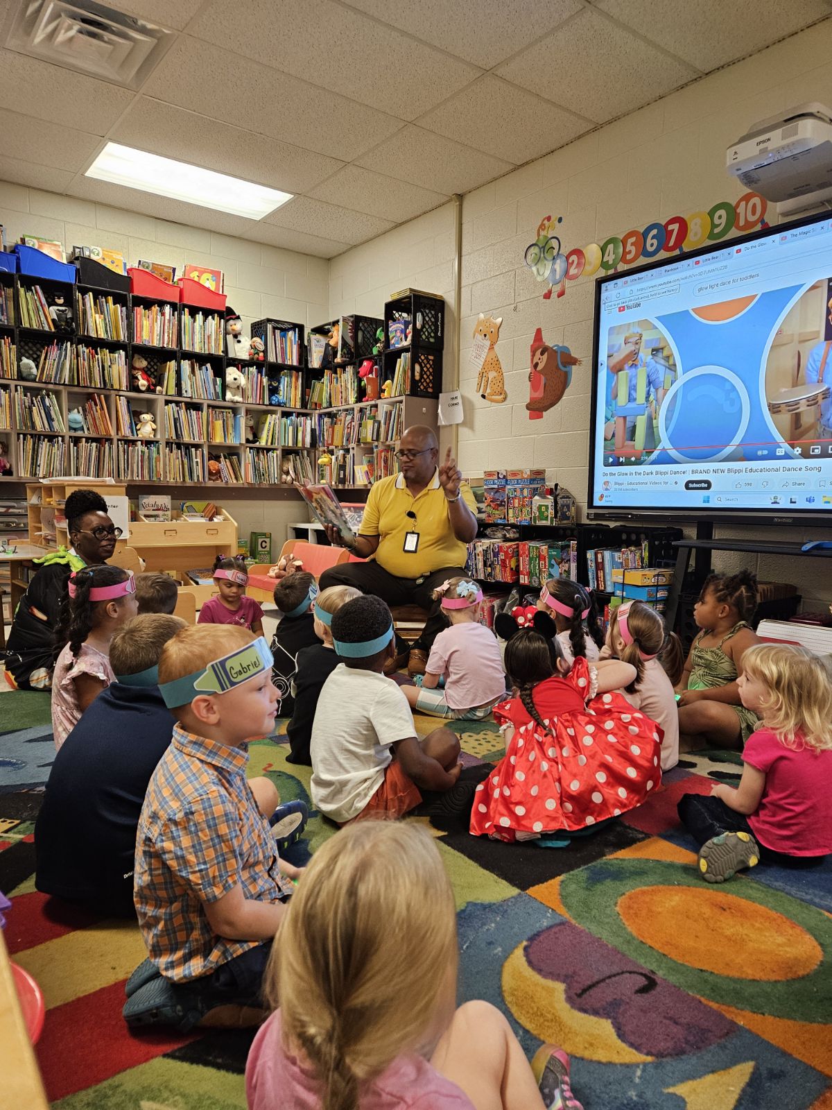 Dr. Holman reads to students