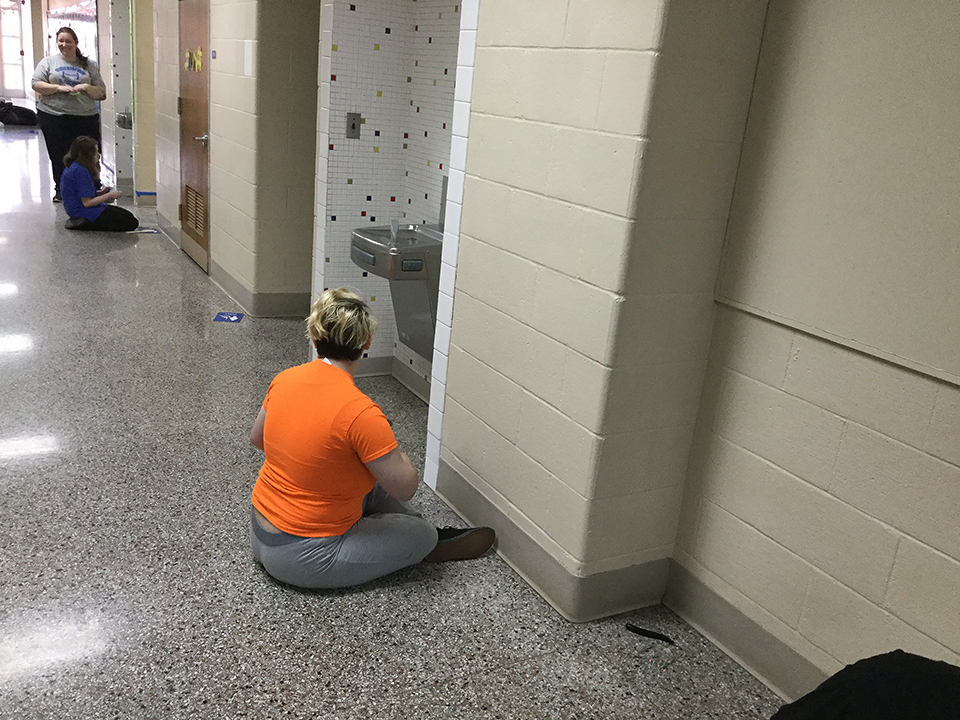 Students volunteering to help paint